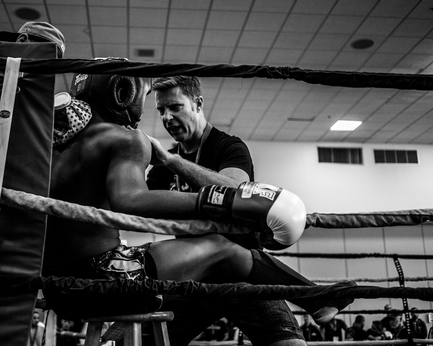 Boxer being coached between rounds.